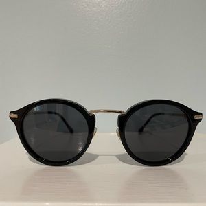 Gucci sunglasses: (GG0917S 001) black frames with gray lenses and gold details.